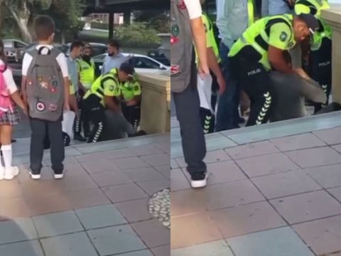 Bakıda şagirdlərin gözləri qarşısında polislə vətəndaş arasında insident - VİDEO  